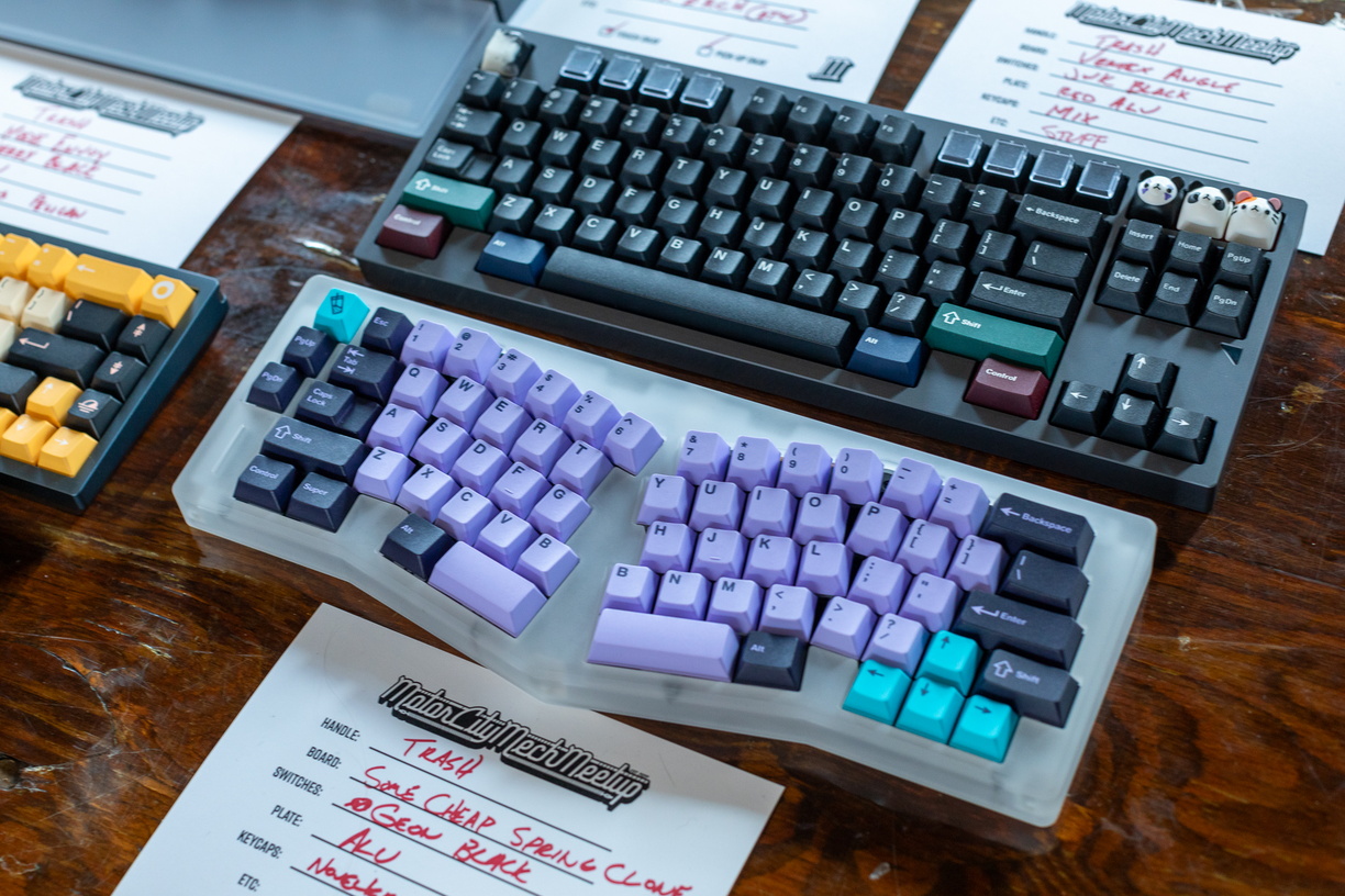 A couple of the boards I brought. A Vertex Angle with a mix of BoW and Dark RGB mods, and some cheap Owlab Spring clone I found on Aliexpress with PBT Taro keycaps